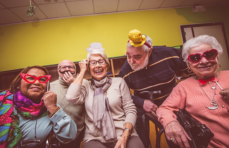 group of senior citizens enjoying the social activities at the homestead of denison in denison, tx